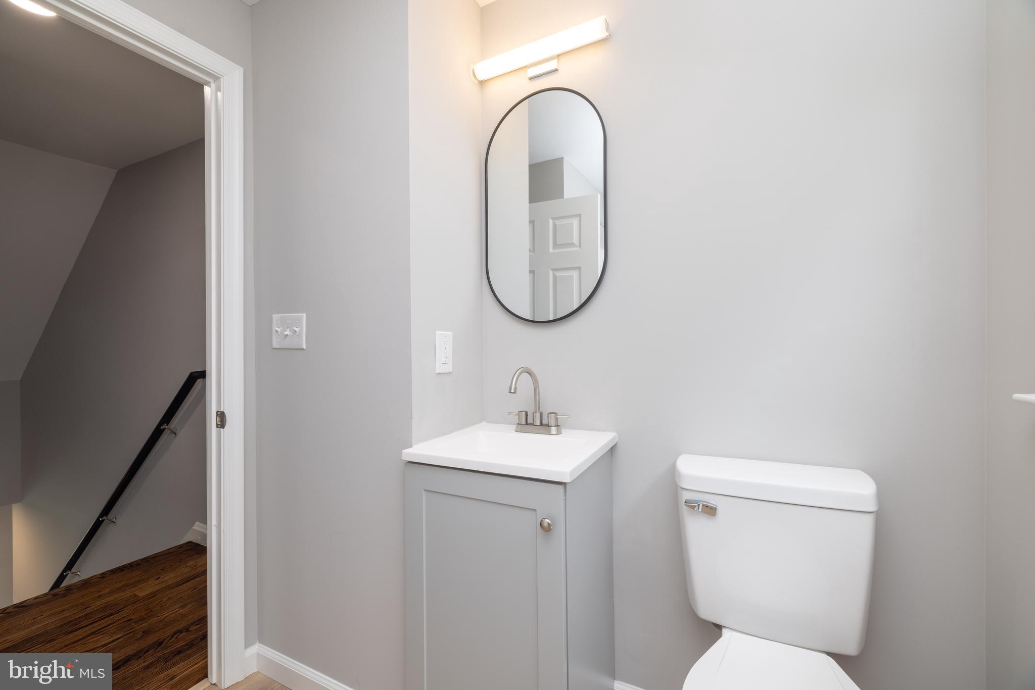 110 Old Point Road Wilmington, DE 19803 - Photo 21 of 27 a bathroom with a toilet sink and mirror