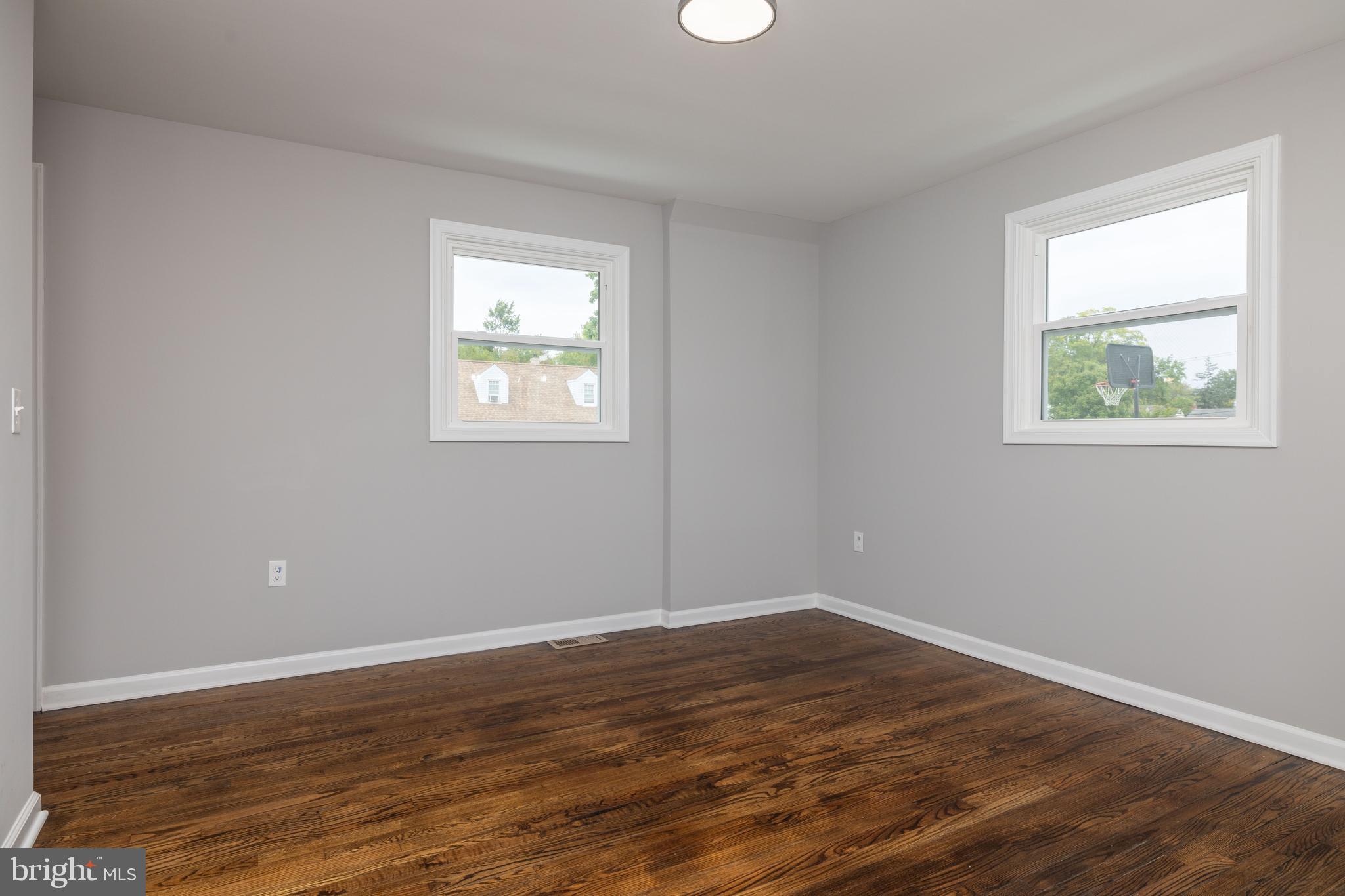 110 Old Point Road Wilmington, DE 19803 - Photo 10 of 27 a view of an empty room with wooden floor and a window