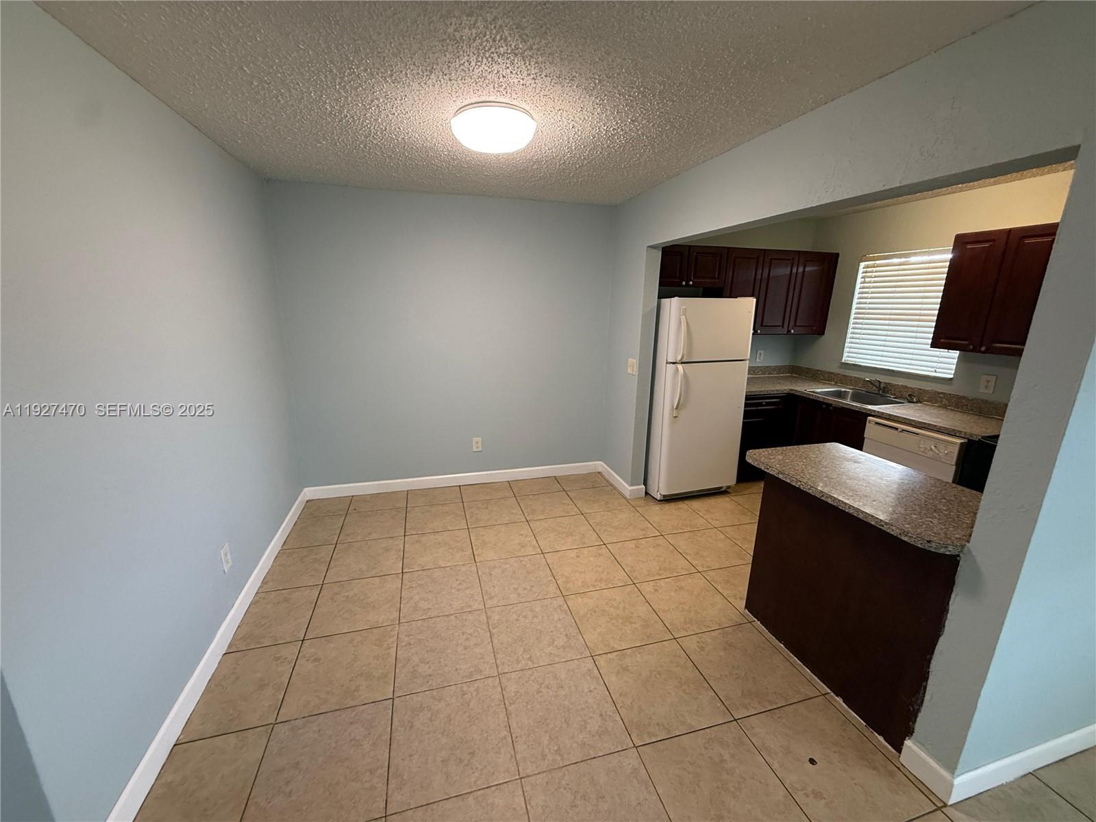 400 Northwest 65th Avenue, Unit 227 Margate, FL 33063 - Photo 11 of 13 a room with a washer and dryer