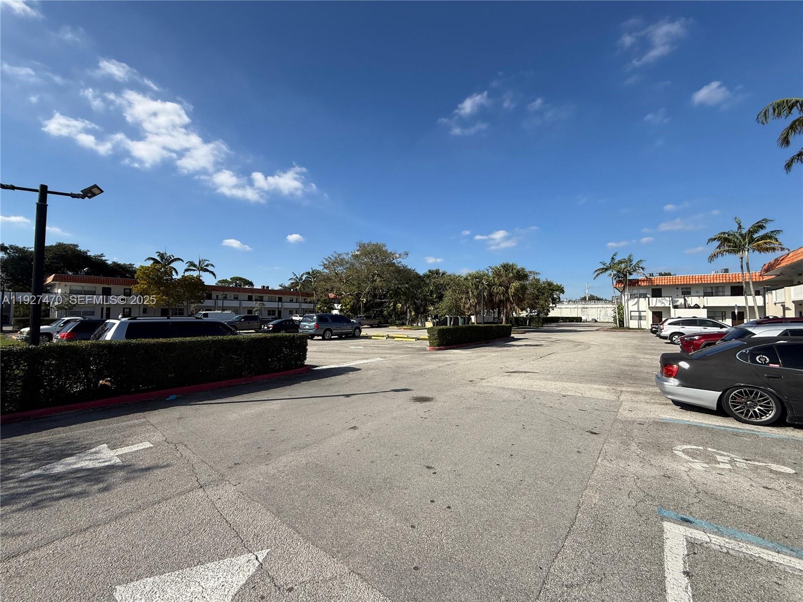 400 Northwest 65th Avenue, Unit 227 Margate, FL 33063 - Photo 2 of 13 a view of street with parked cars