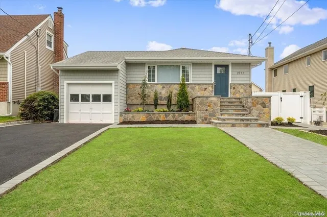 a front view of a house with yard