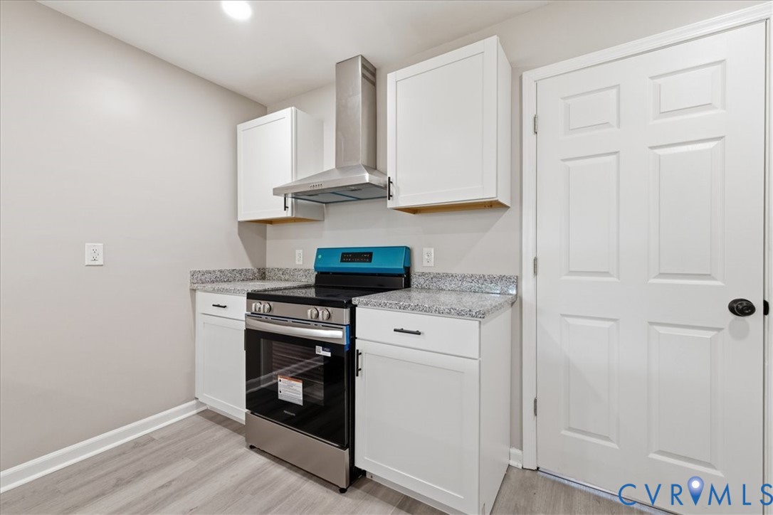 5306 Sterling Road Petersburg, VA 23803 - Photo 11 of 39 a kitchen with white cabinets and appliances