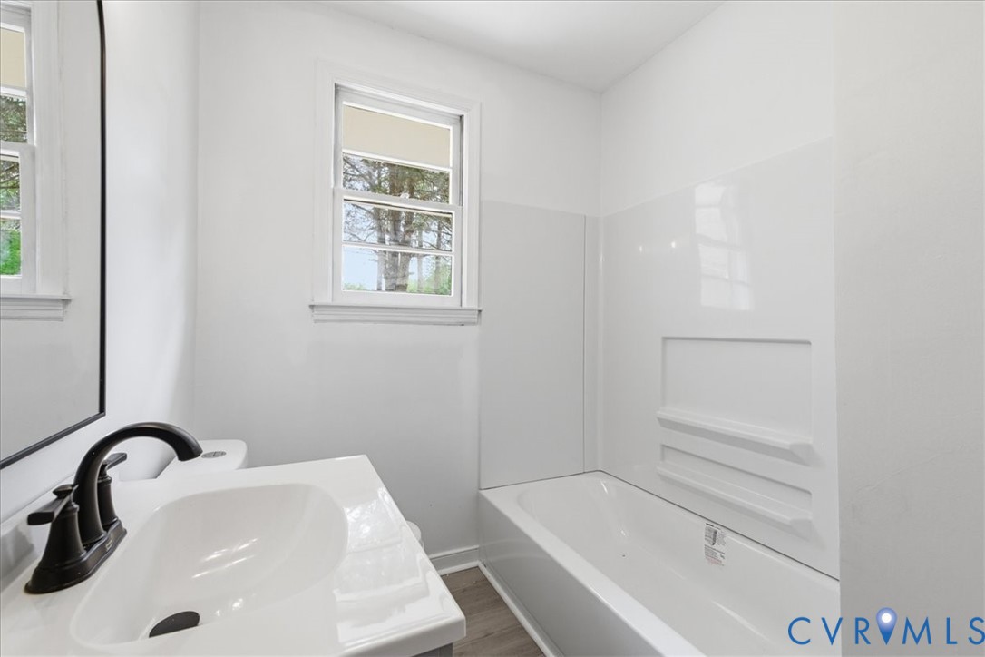 5306 Sterling Road Petersburg, VA 23803 - Photo 15 of 39 a bathroom with a sink and mirror