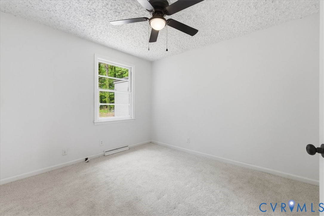 5306 Sterling Road Petersburg, VA 23803 - Photo 20 of 39 an empty room with a window and a ceiling fan