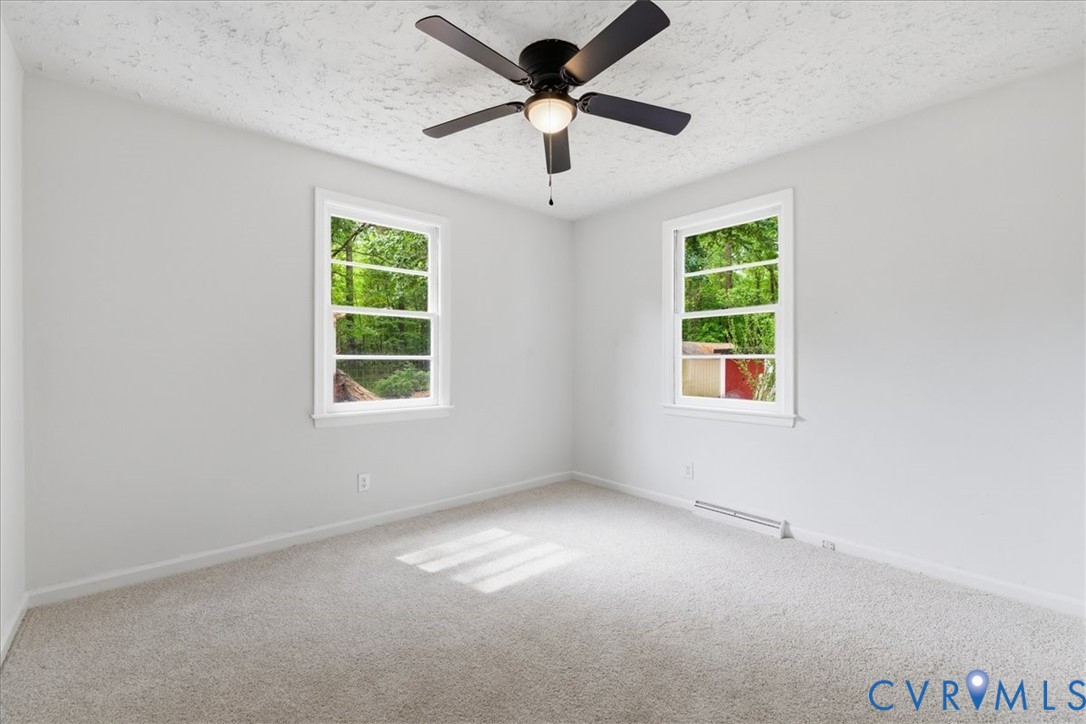 5306 Sterling Road Petersburg, VA 23803 - Photo 23 of 39 an empty room with a window and a fan