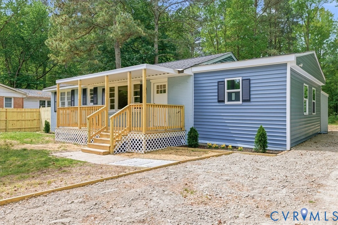 5306 Sterling Road Petersburg, VA 23803 - Photo 36 of 39 a front view of a house with a yard and garage