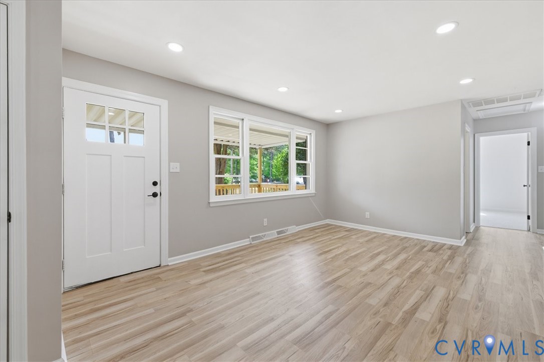 5306 Sterling Road Petersburg, VA 23803 - Photo 4 of 39 an empty room with wooden floor and windows