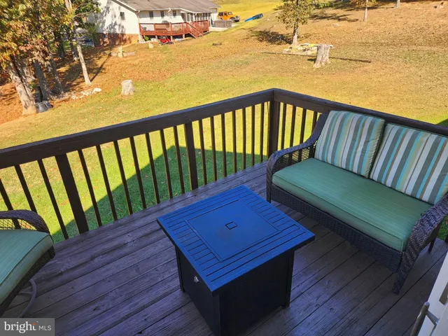a view of a two chairs in the balcony