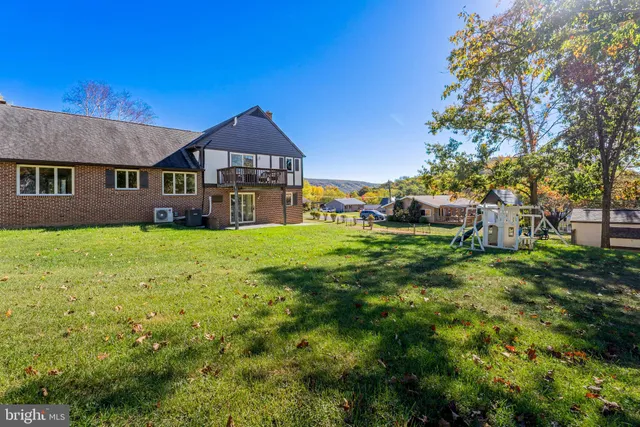 a view of a house with a big yard