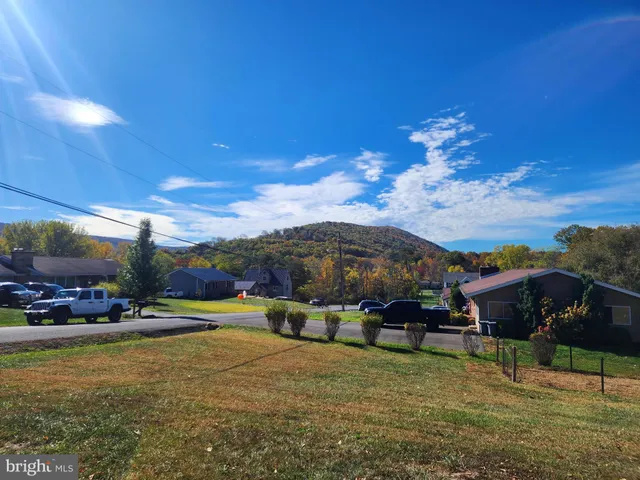 a terrace with outdoor seating and city view