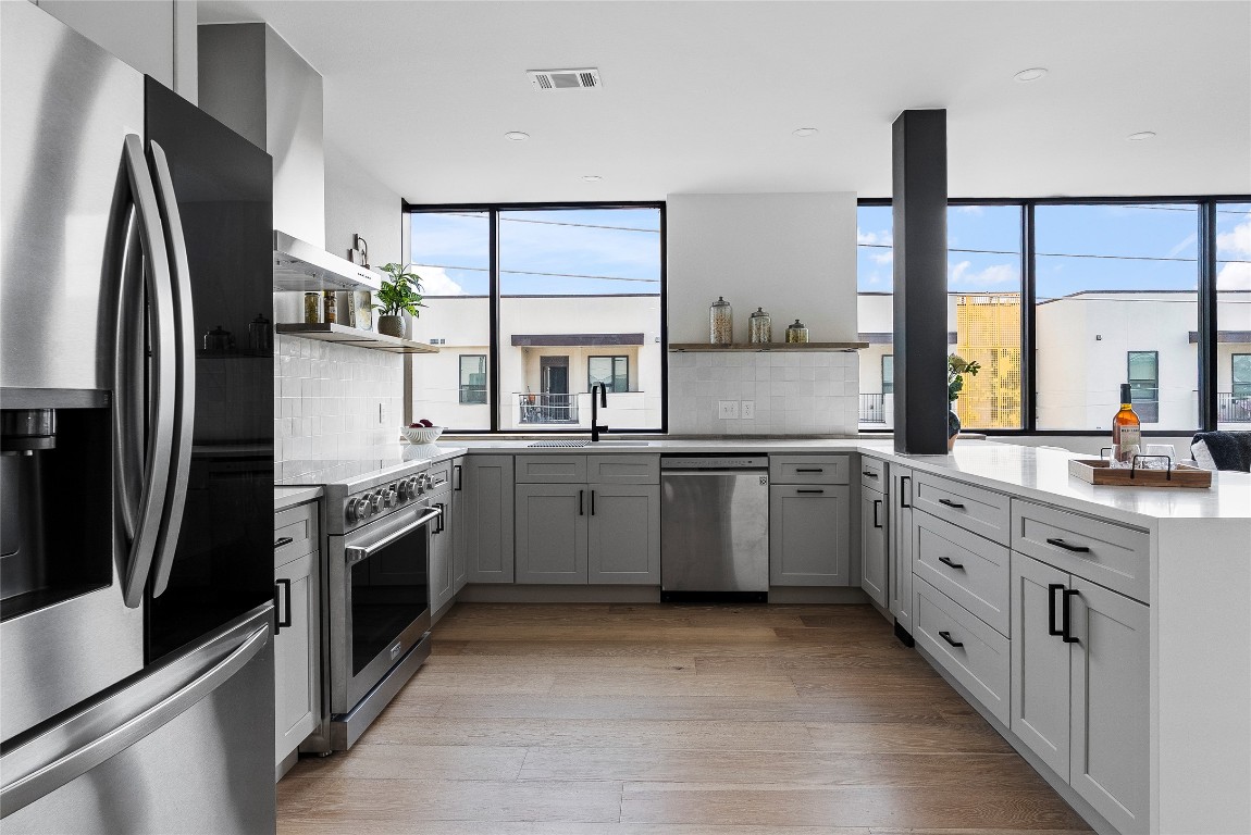 1800 East 4th Street, Unit 396 Austin, TX 78702 - Photo 1 of 20 a kitchen with a sink stove and refrigerator