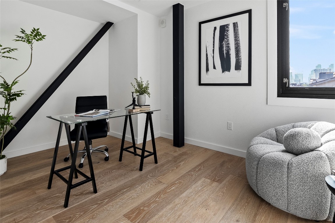 1800 East 4th Street, Unit 396 Austin, TX 78702 - Photo 11 of 20 a workspace with furniture and wooden floor