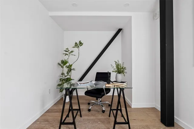 a view of a workspace with furniture