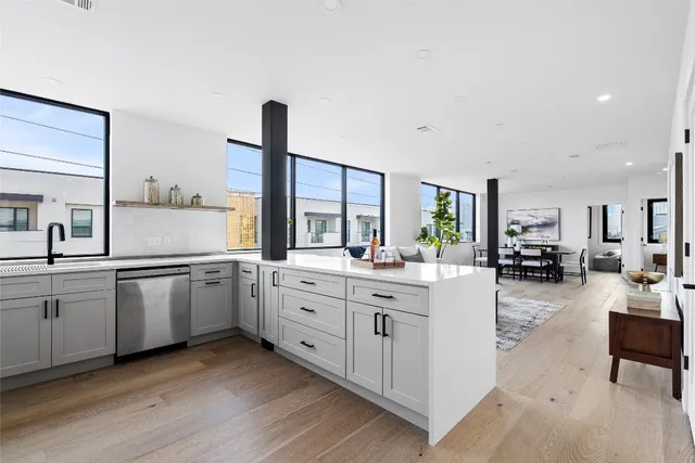 a kitchen with sink and cabinets