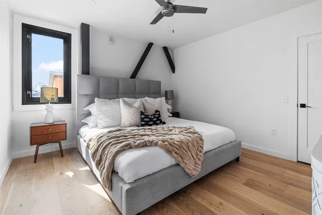 a bedroom with a bed and a couch