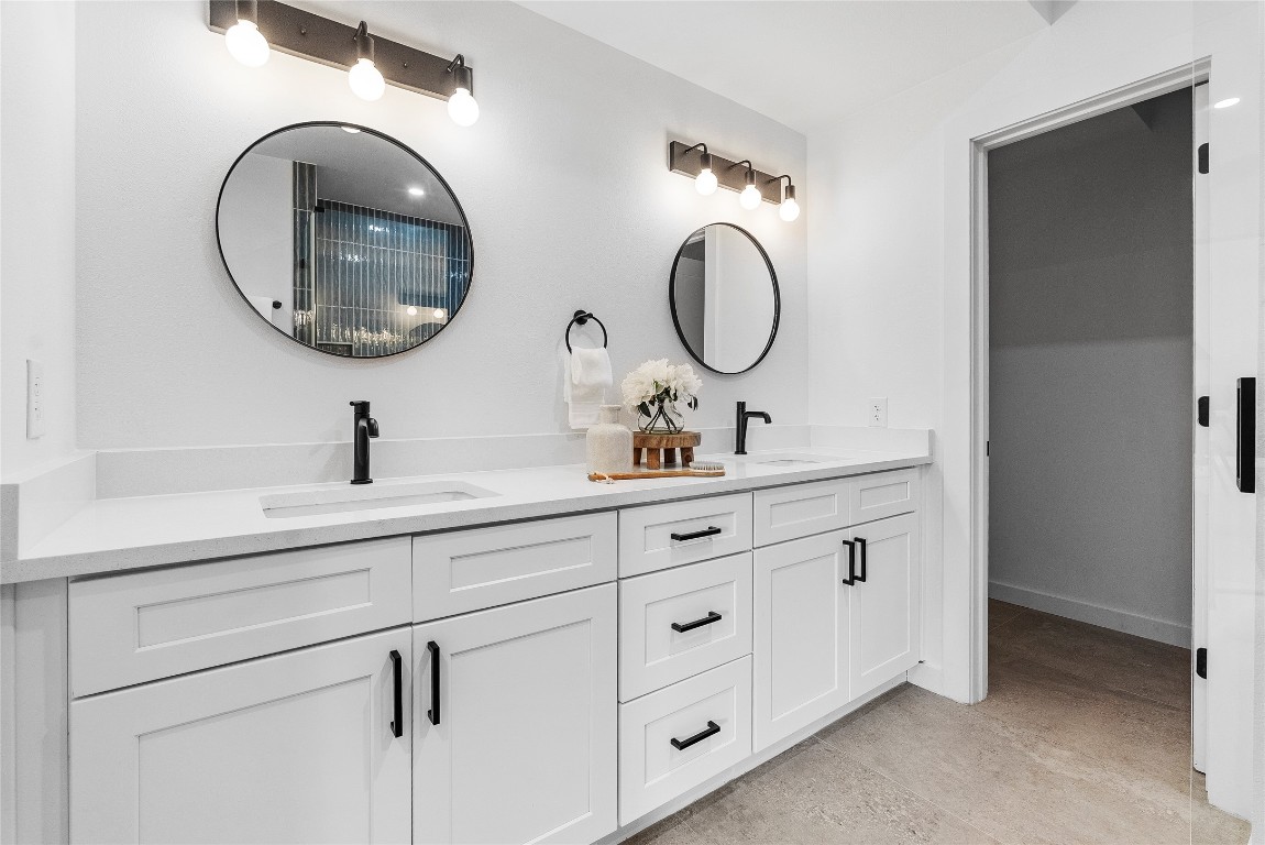 1800 East 4th Street, Unit 396 Austin, TX 78702 - Photo 7 of 20 a bathroom with a double vanity sink and a mirror