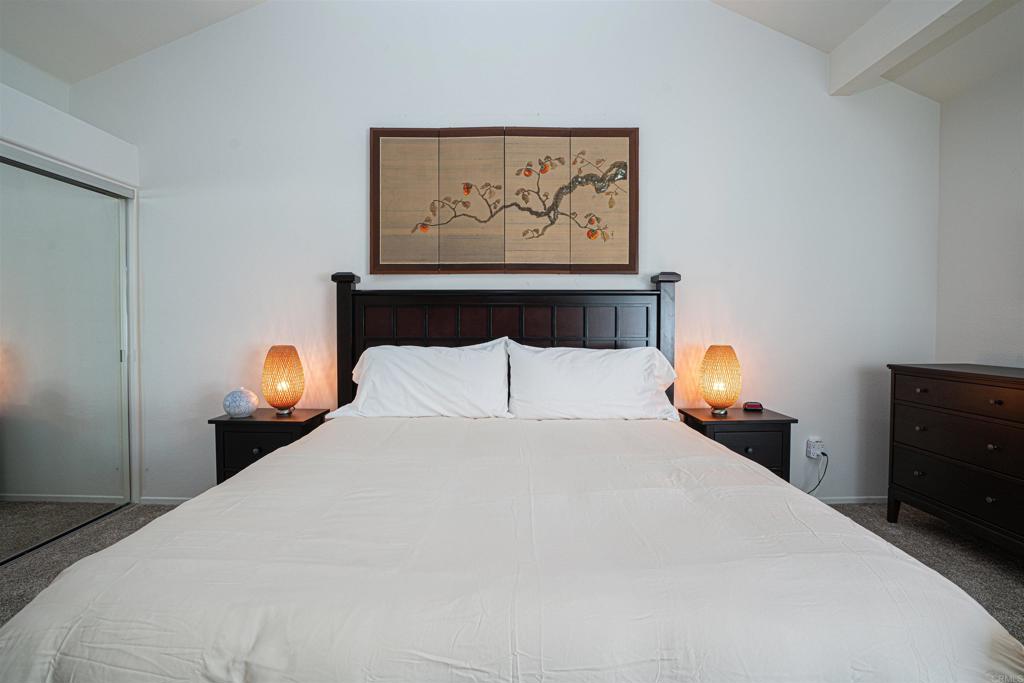 4717 Majorca Way Oceanside, CA 92056 - Photo 11 of 33 a bedroom with a bed and painting on the wall