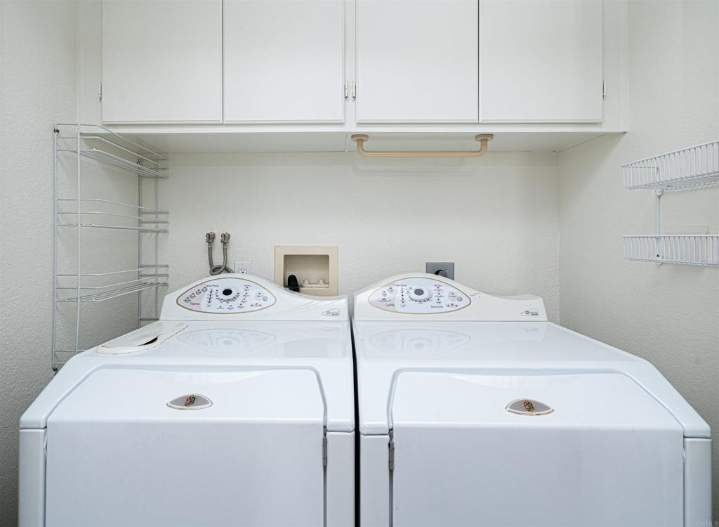 4717 Majorca Way Oceanside, CA 92056 - Photo 18 of 33 a utility room with dryer and washer