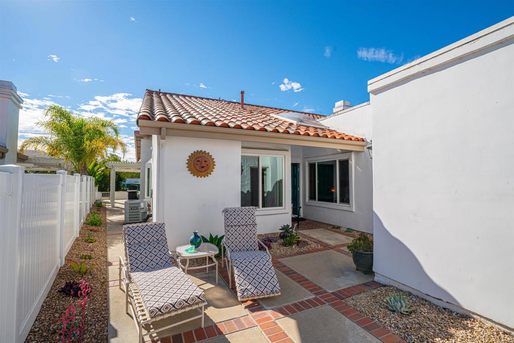 4717 Majorca Way Oceanside, CA 92056 - Photo 20 of 33 a front view of a house with garden