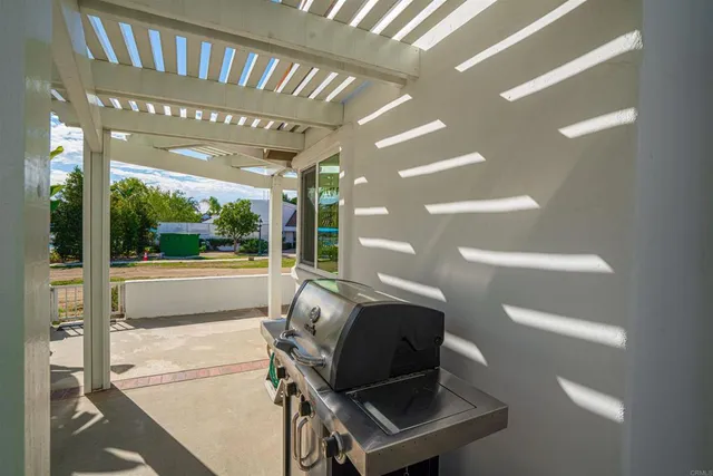 a picture of a building with a garden and plants