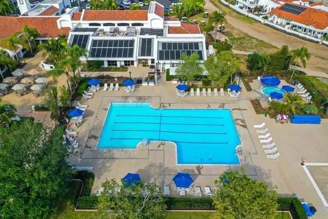 a view of patio with a table and chairs under an umbrella