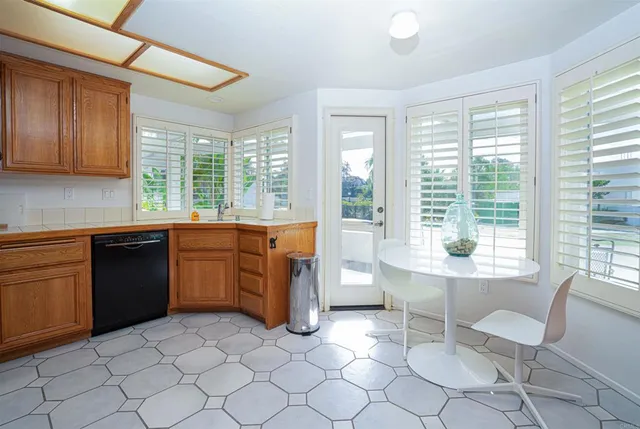 a kitchen with a sink and a stove top oven