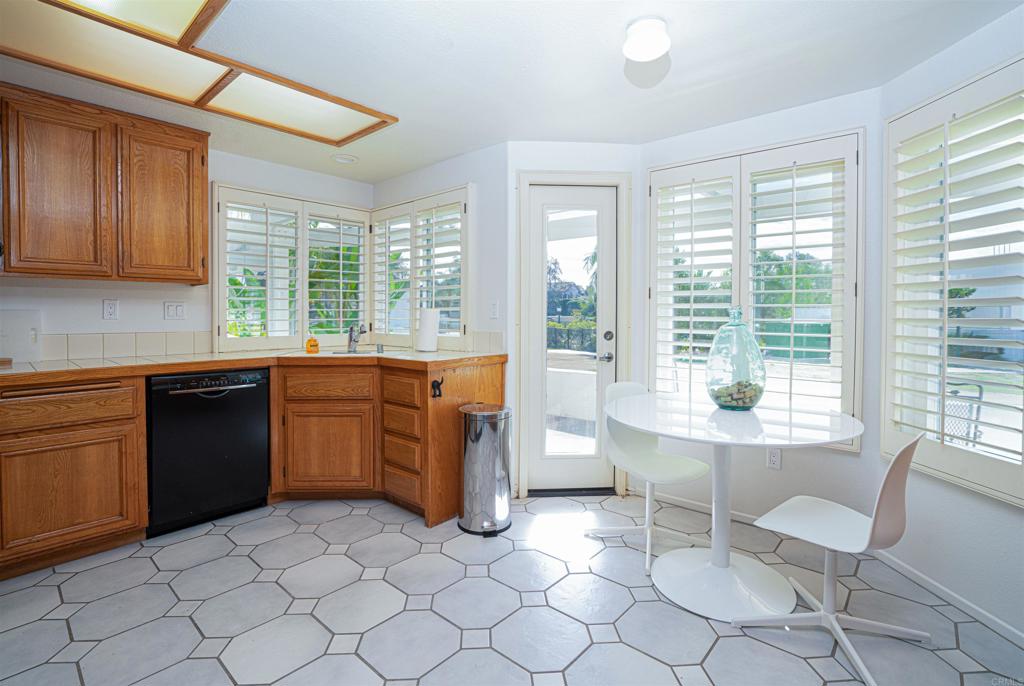 4717 Majorca Way Oceanside, CA 92056 - Photo 4 of 33 a kitchen with a sink and a stove top oven