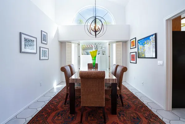a dining room with furniture and window