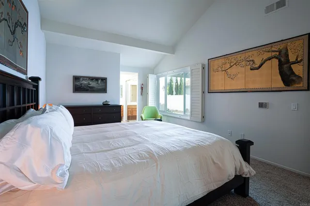 a bedroom with a bed and dresser