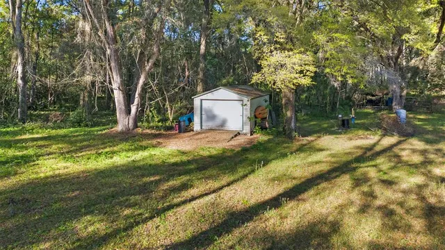 a view of a fire pit in a backyard