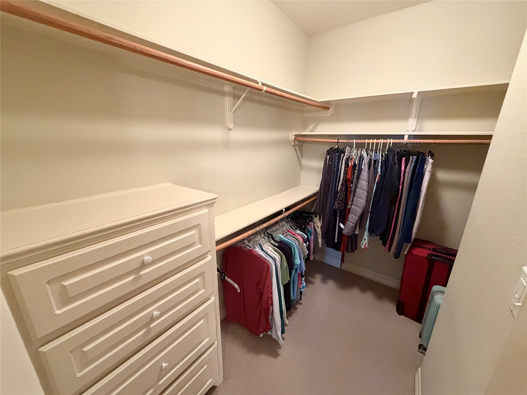 1448 South Blue Bonnet Lane Angleton, TX 77515 - Photo 29 of 43 a view of walk in closet with clothes and shoes