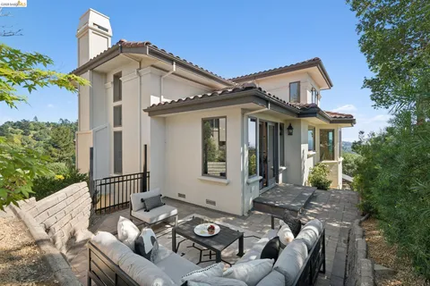 a kitchen with stainless steel appliances granite countertop a stove a sink and a wooden floors
