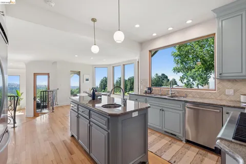 a view of a livingroom with furniture window and wooden floor