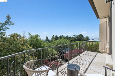 a view of a balcony with chairs