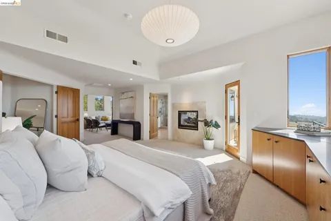 a bathroom with a double vanity sink mirror and shower
