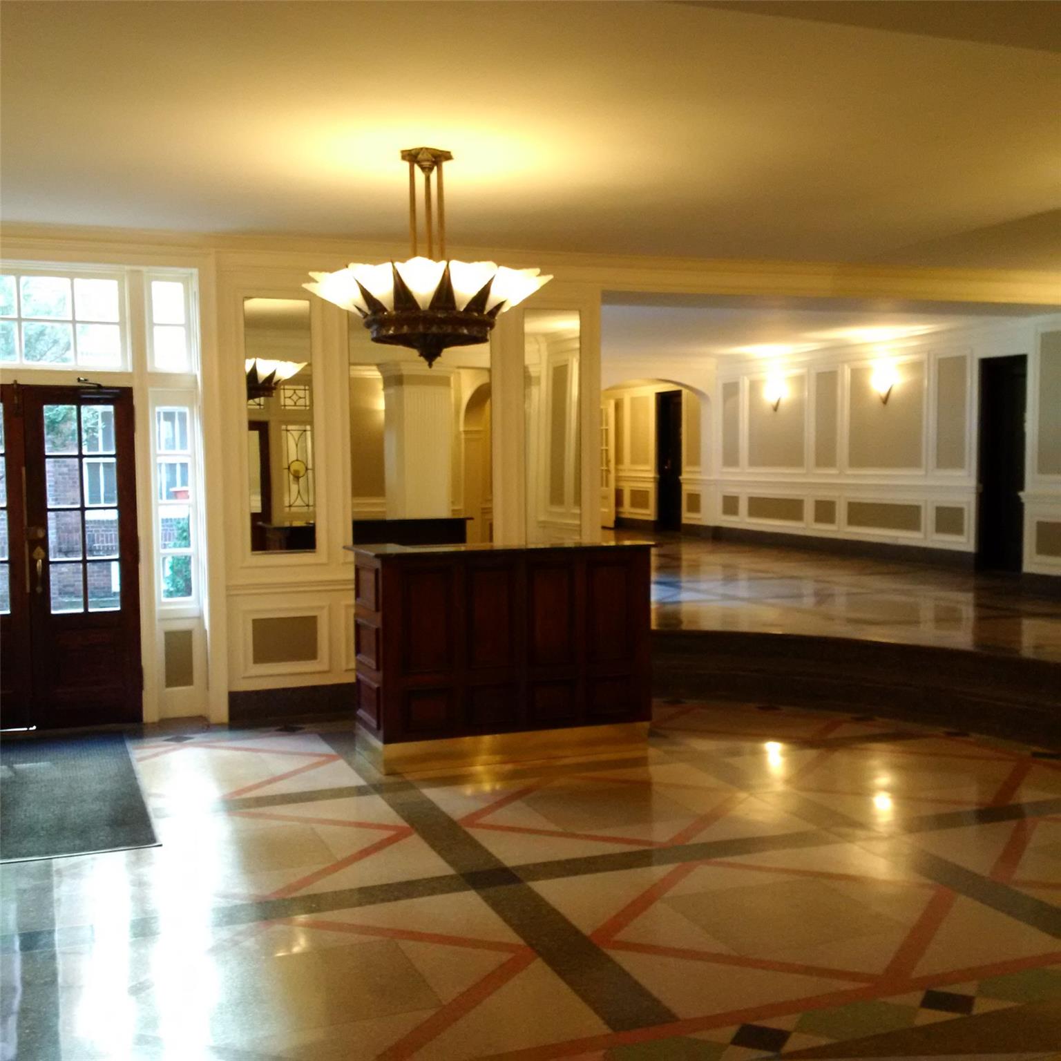 110-07 73rd Road, Unit 4D Queens, NY 11375 - Photo 16 of 16 Reception with arched walkways, a decorative wall, a chandelier, and french doors