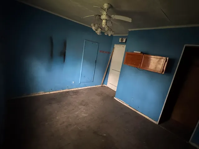 a view of an empty room with a window