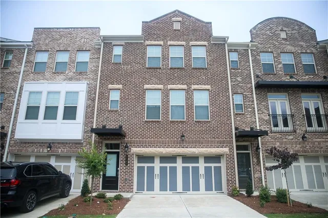a front view of a building with balcony