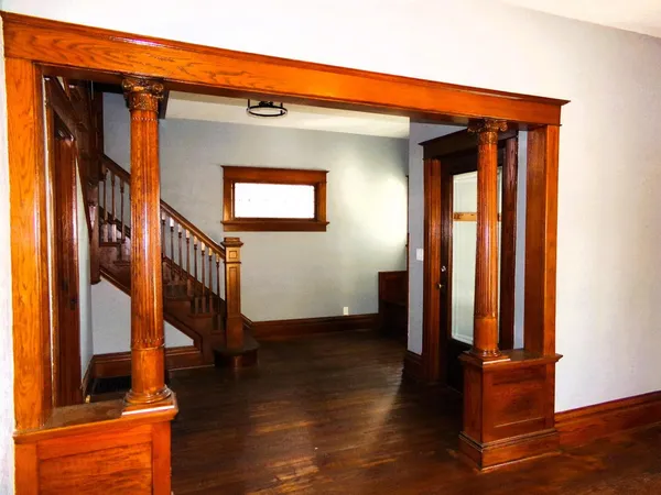 a view of front door with wooden floor