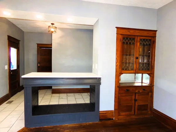 a view of fireplace and wooden floor