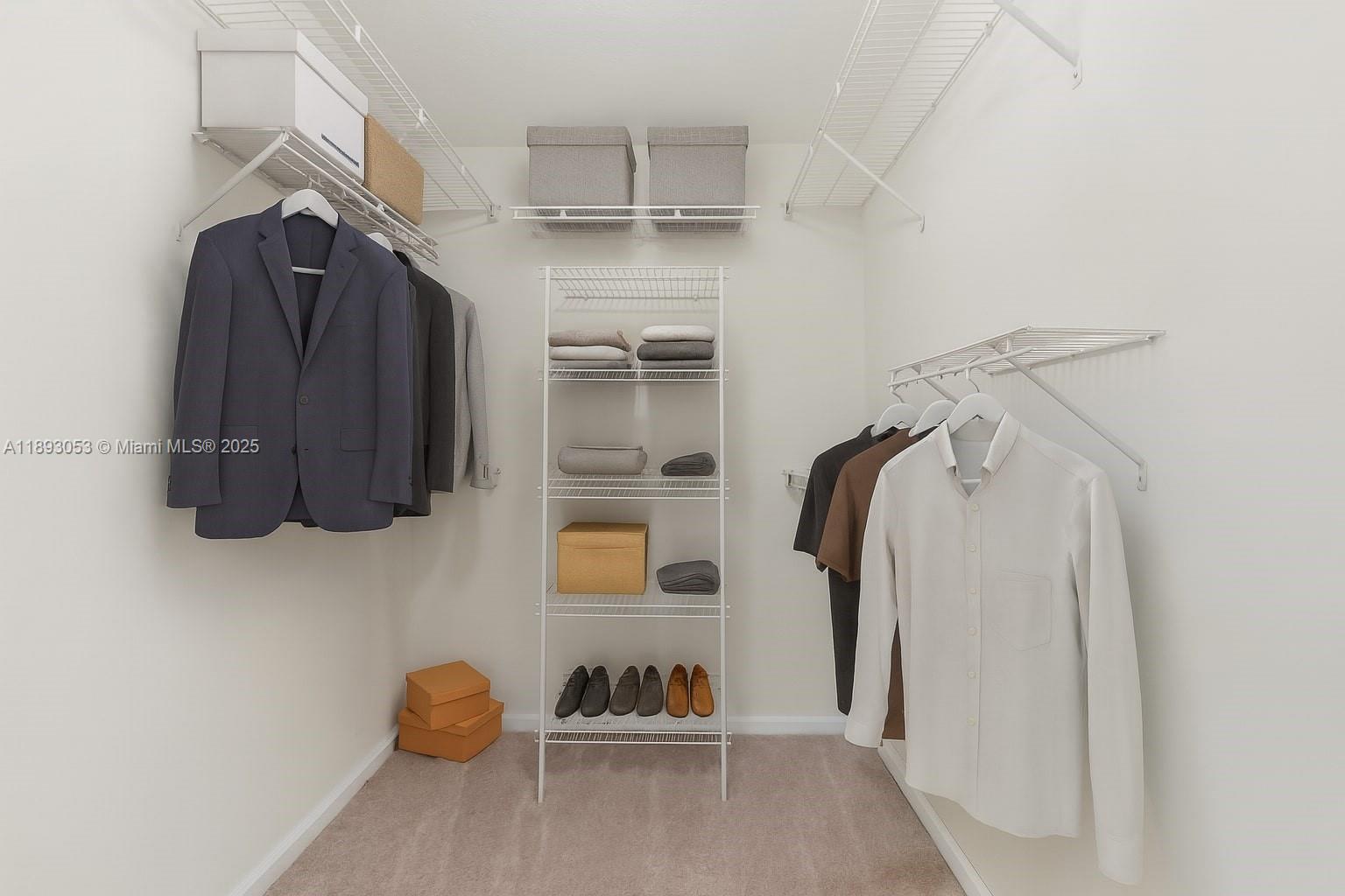 275 Murcia Drive, Unit 104 Jupiter, FL 33458 - Photo 11 of 26 a view of walk in closet with clothes and shoes