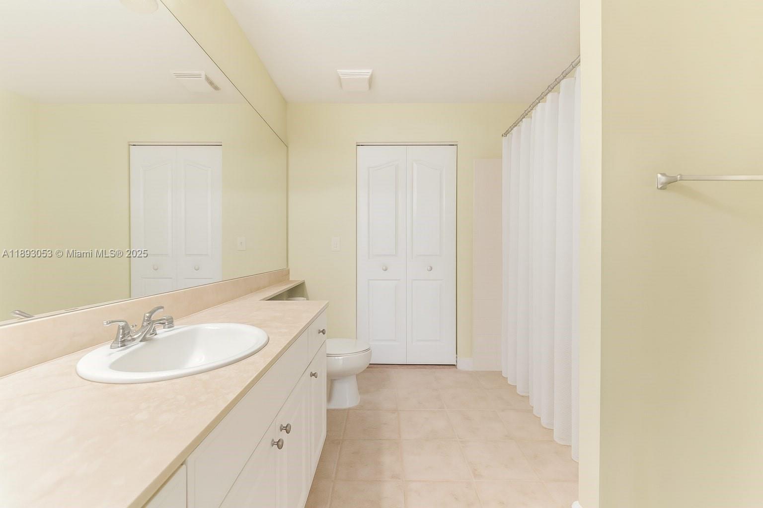 275 Murcia Drive, Unit 104 Jupiter, FL 33458 - Photo 12 of 26 a bathroom with a sink and a mirror
