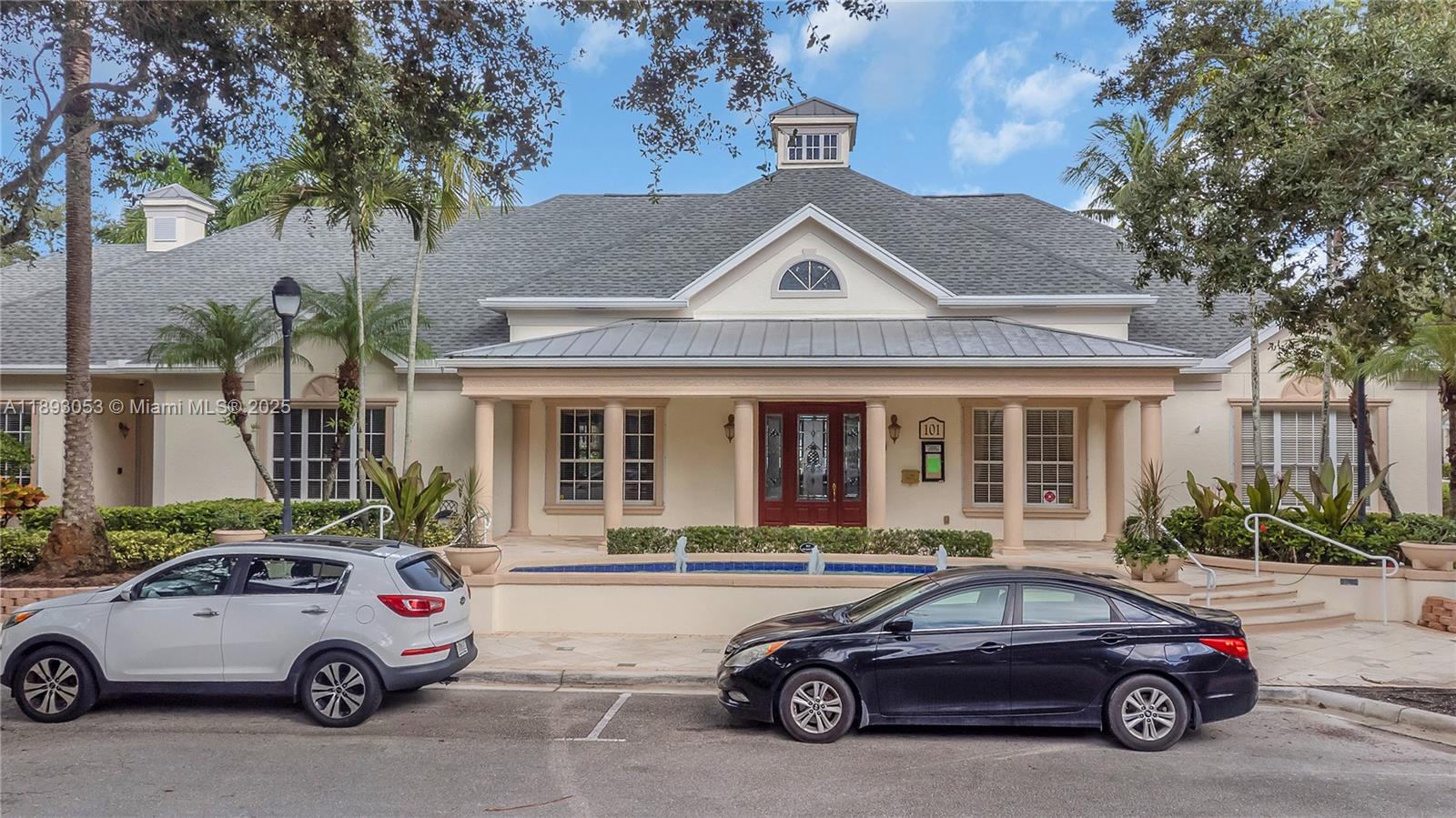 275 Murcia Drive, Unit 104 Jupiter, FL 33458 - Photo 20 of 26 a car parked in front of a house