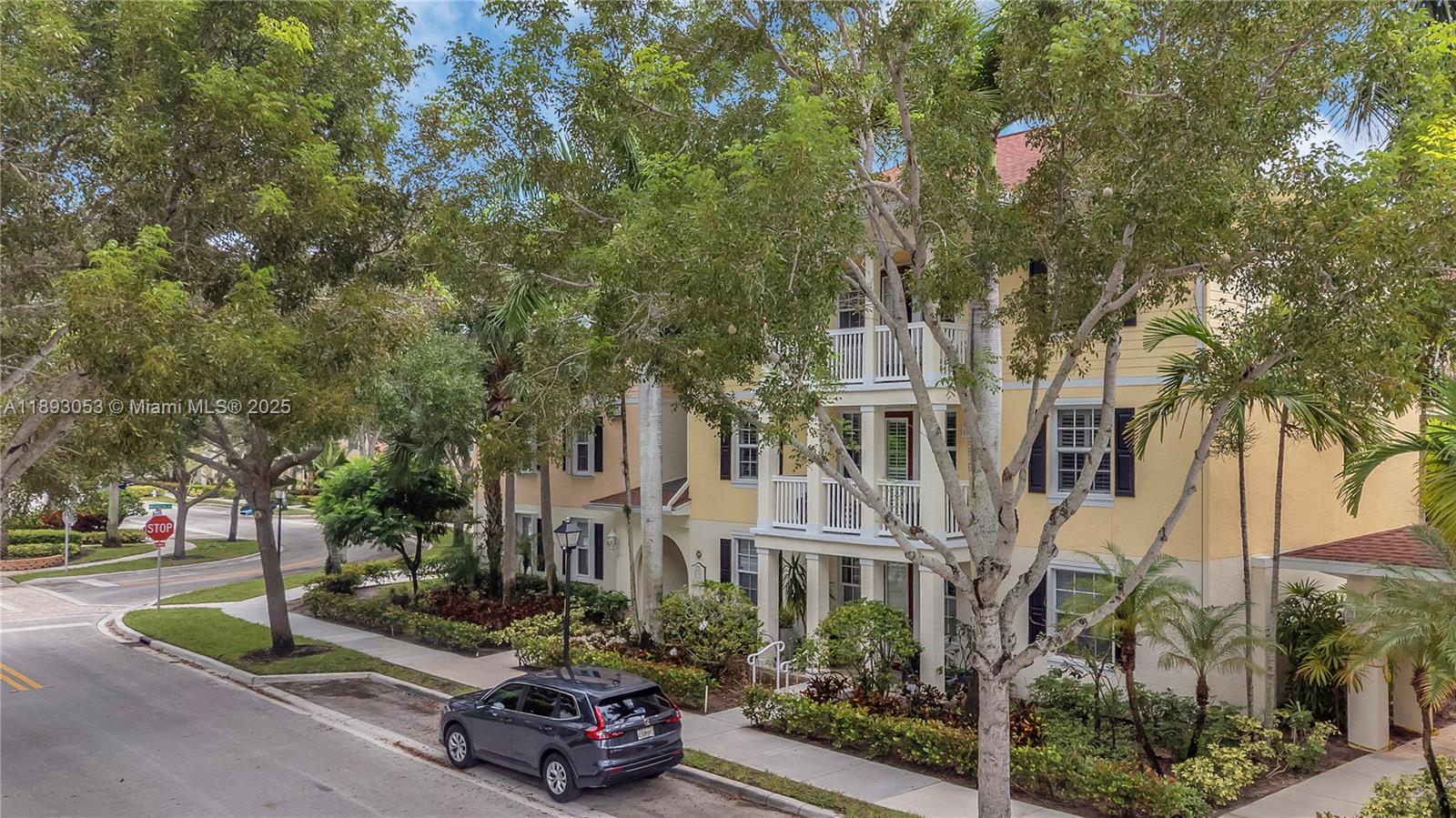 275 Murcia Drive, Unit 104 Jupiter, FL 33458 - Photo 25 of 26 a car parked on the side of a street