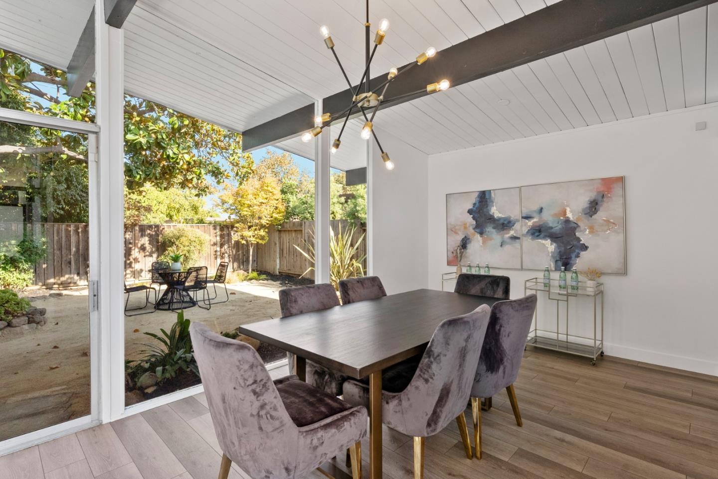 1420 Mallard Way Sunnyvale, CA 94087 - Photo 14 of 48 a view of a dining room with furniture large windows and wooden floor