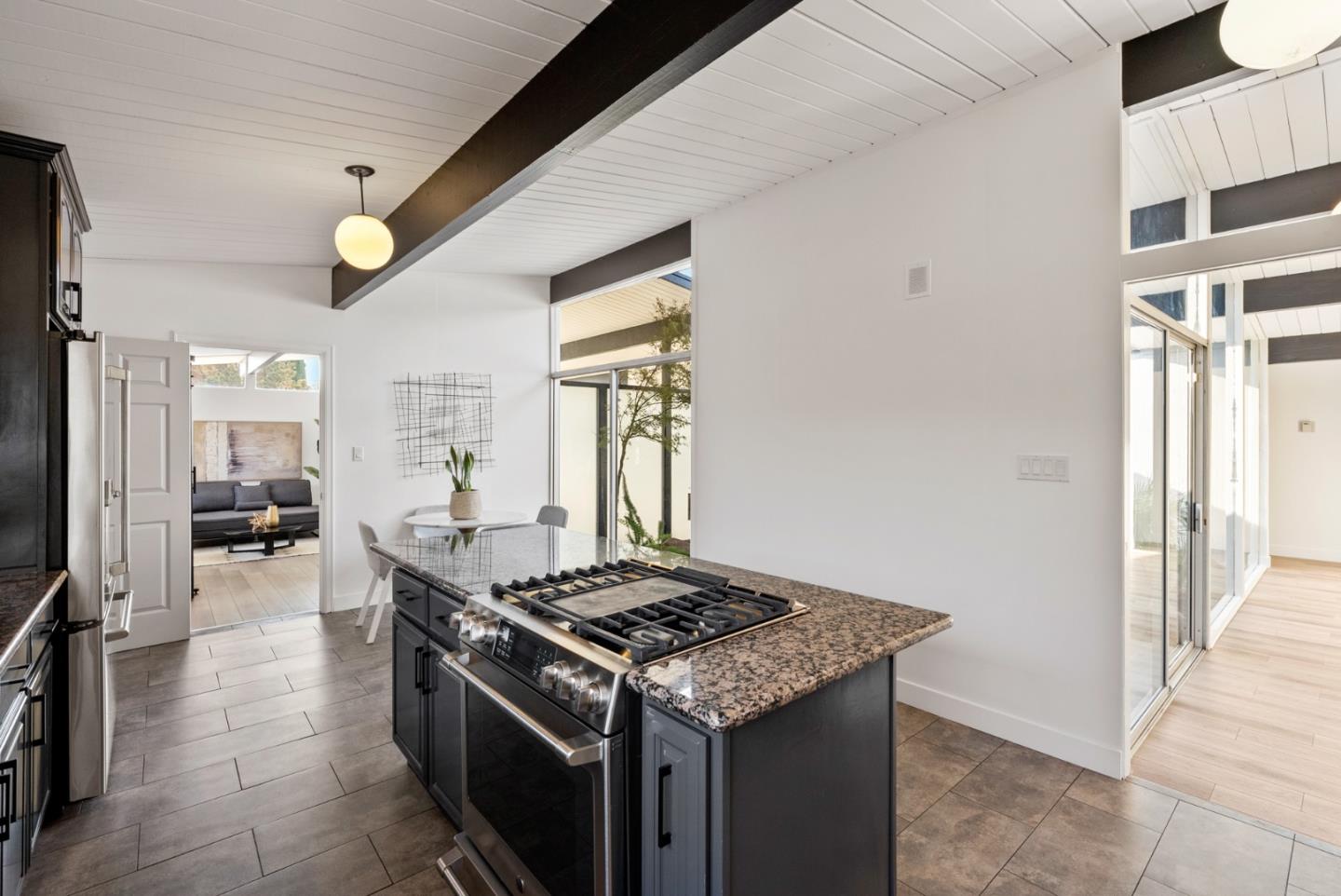 1420 Mallard Way Sunnyvale, CA 94087 - Photo 16 of 48 a kitchen that has a stove and a table in it