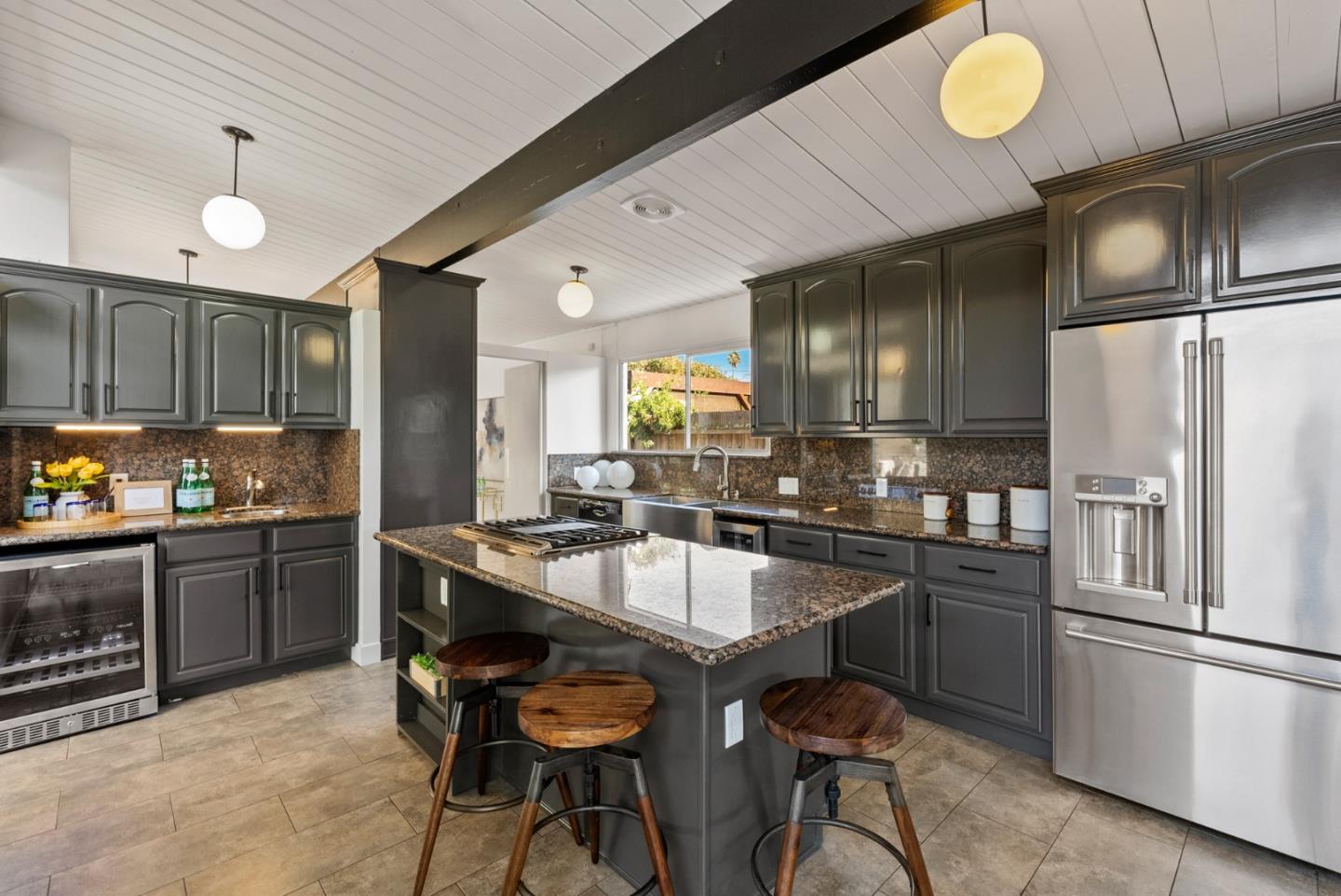 1420 Mallard Way Sunnyvale, CA 94087 - Photo 19 of 48 a kitchen with granite countertop a sink stainless steel appliances and cabinets