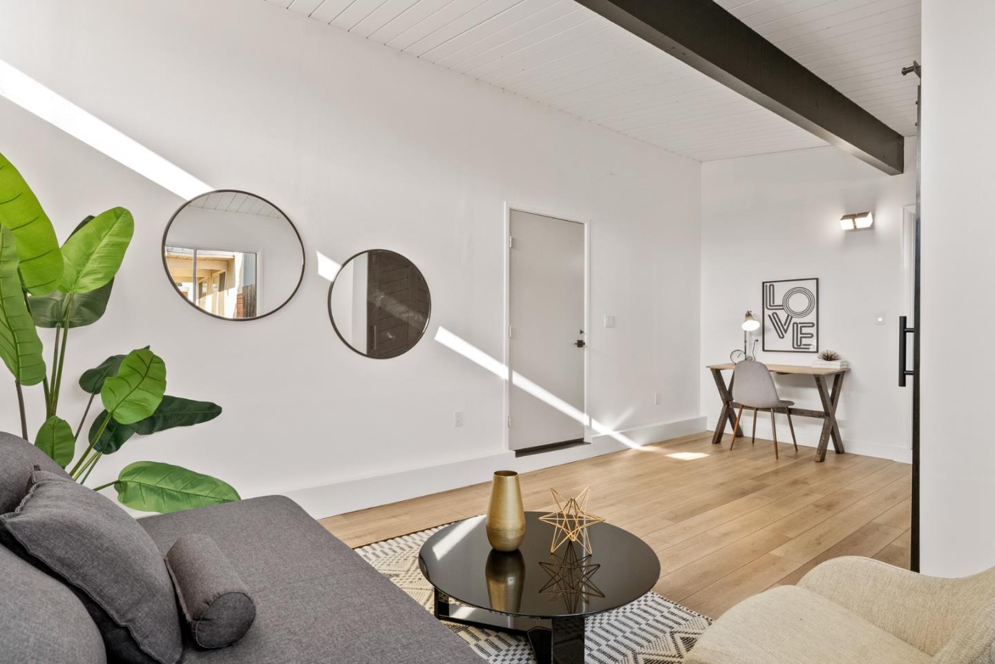 1420 Mallard Way Sunnyvale, CA 94087 - Photo 24 of 48 a living room with furniture and a mirror