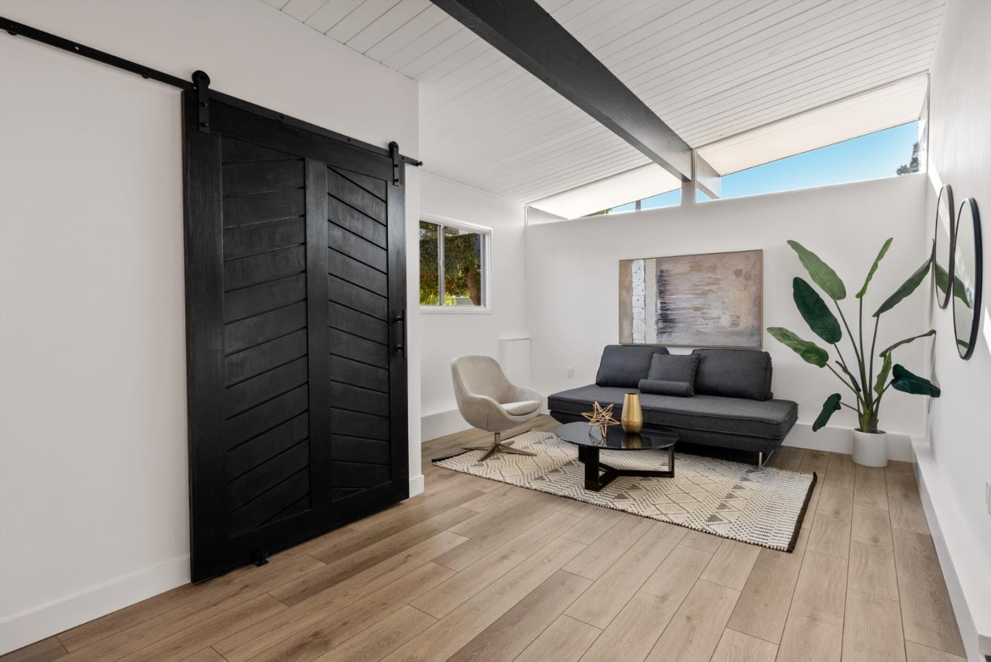 1420 Mallard Way Sunnyvale, CA 94087 - Photo 25 of 48 a living room with furniture and a wooden floor