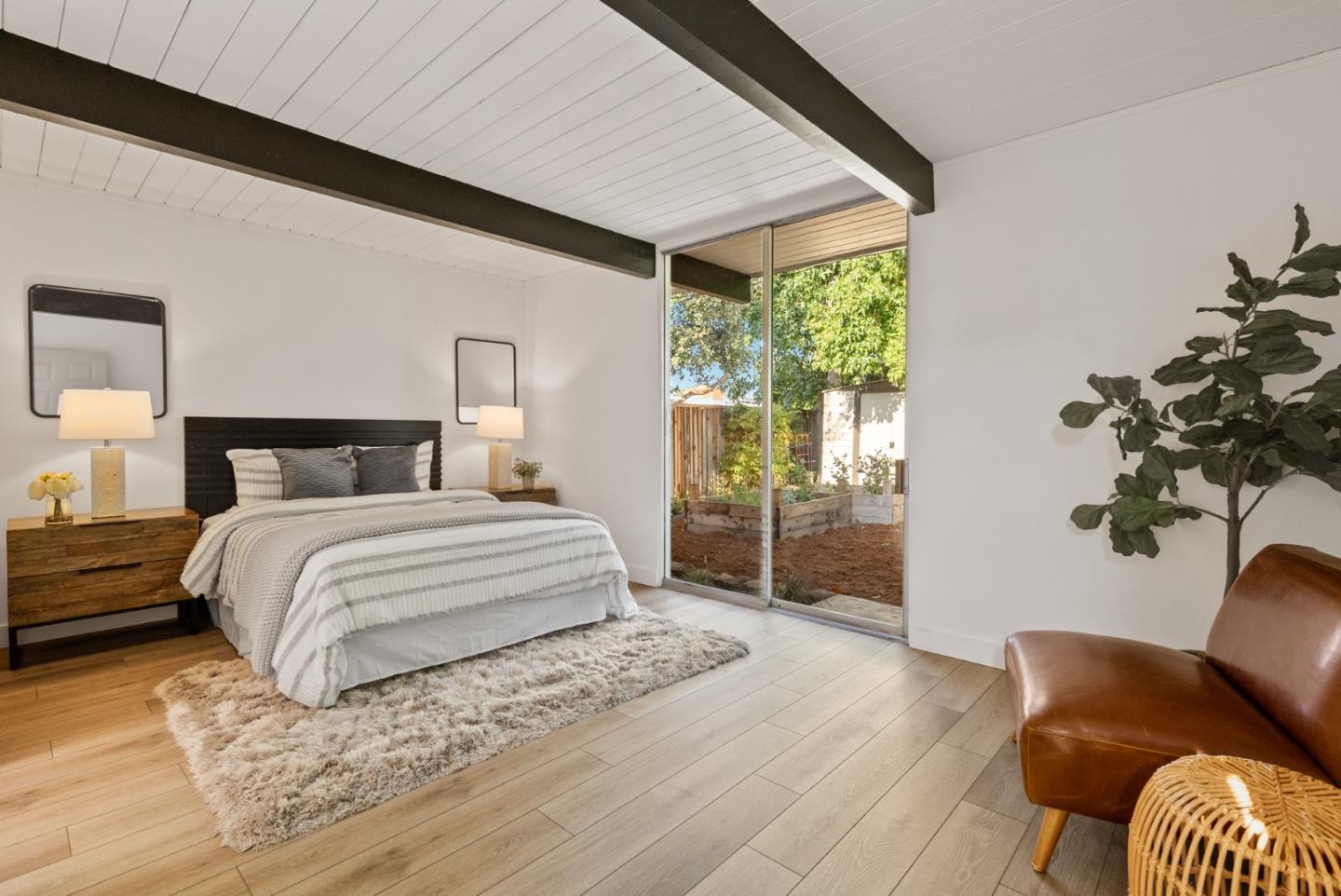 1420 Mallard Way Sunnyvale, CA 94087 - Photo 27 of 48 a bedroom with a large bed and a couch